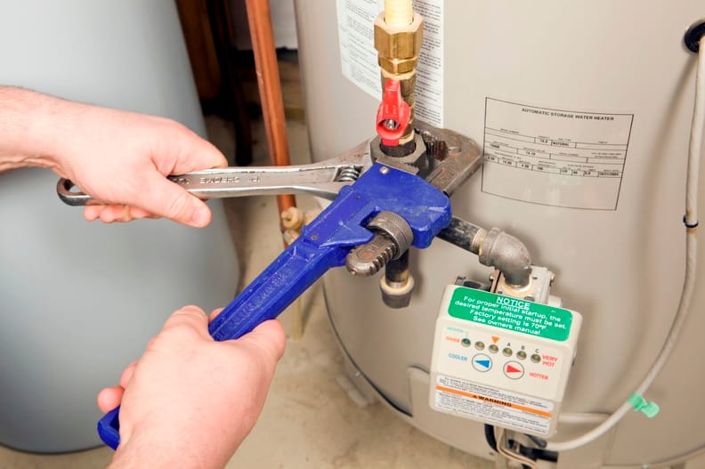 Plumber repairing a water heater valve in Port Orange